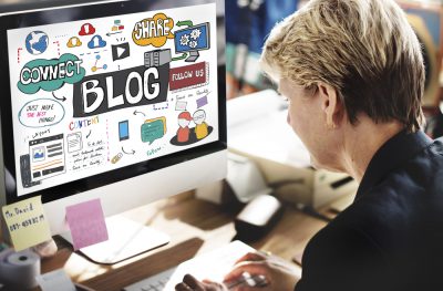 Woman Looking at Blog on Computer